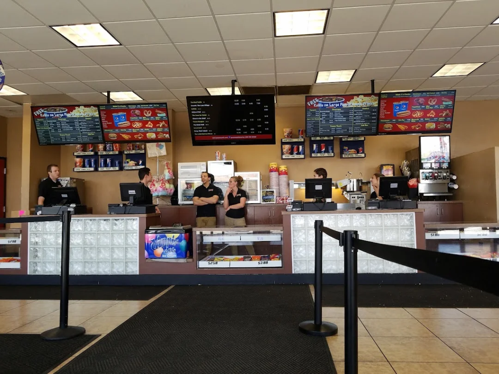 Paramount 5 Rexburg Concessions A nostalgic view of the Paramount 5 movie theater concessions counter in Rexburg, featuring classic popcorn machines and menu boards.