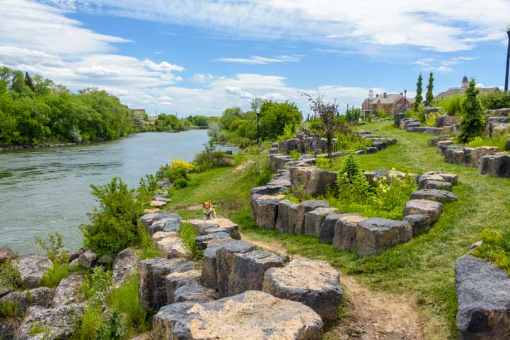 Idaho Falls Greenbelt River Walk A peaceful view of the Idaho Falls Greenbelt and River Walk with the waterfalls and surrounding walking paths at dusk.
